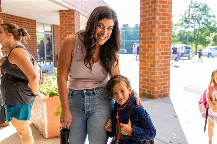A mother and son smile